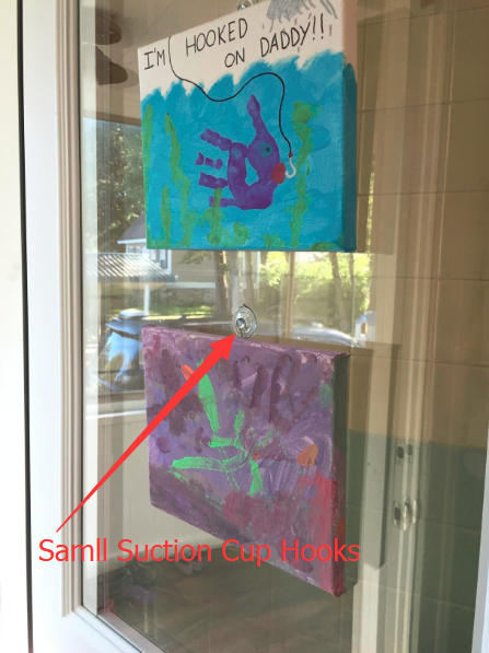 suction cup hooks to hang some art on the window